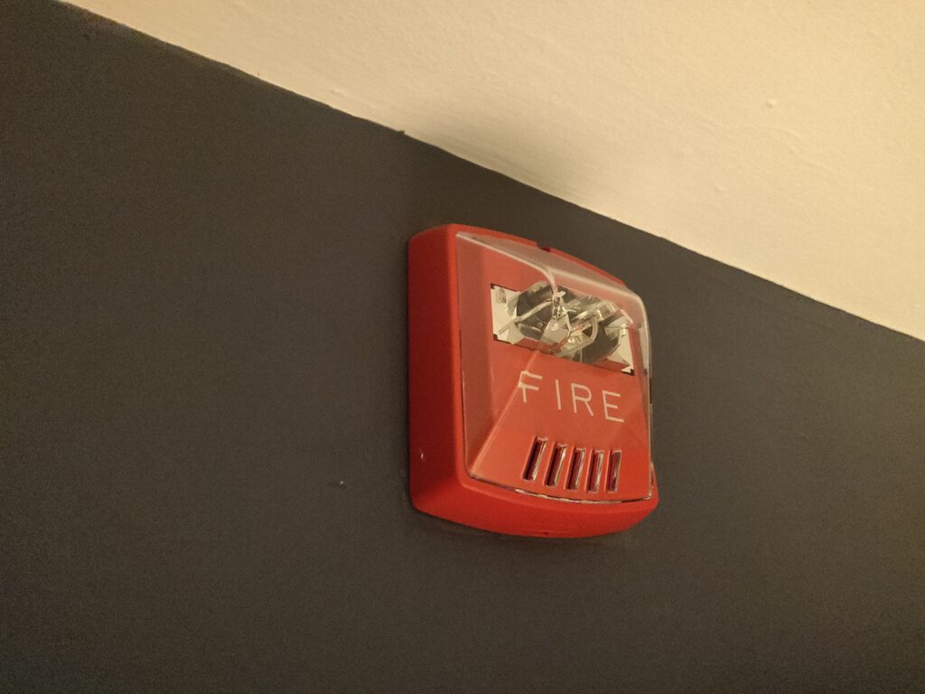 Monitored smoke and fire alarm on a ceiling