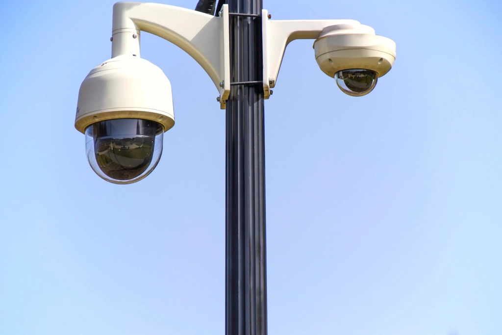 Home security system cost in San Antonio — security camera protecting a home